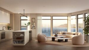 Modern corner apartment interior with open kitchen, floor-to-ceiling windows, and Golden Gate Bridge views over the San Francisco Bay.